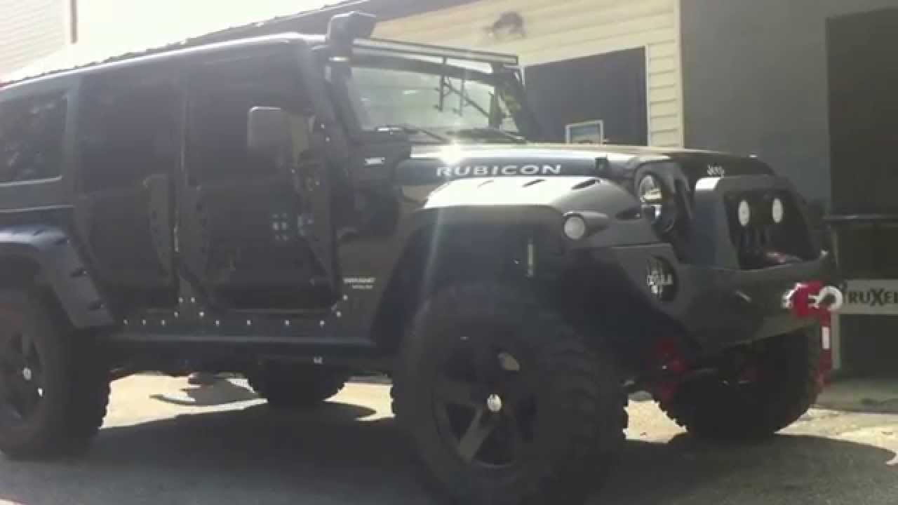 Horn blasters train air horns Jeep Wrangler customized with lift