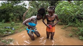 How African Girls Bath In The River In The Village