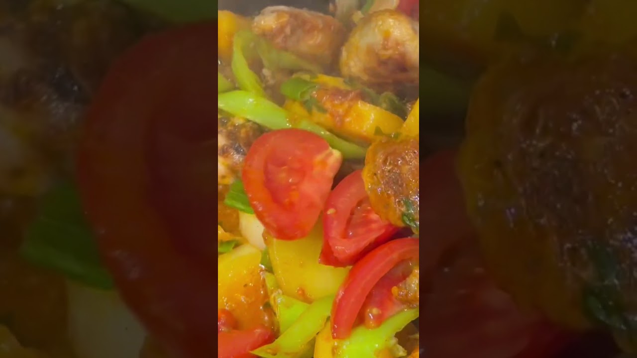 Super delicious chicken wings with potatoes, banana peppers and tomatoes
