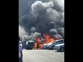 London: Flames engulf cars in front of shopping center
