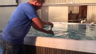How to clean a hot tub without draining, pump, with only short hose.
