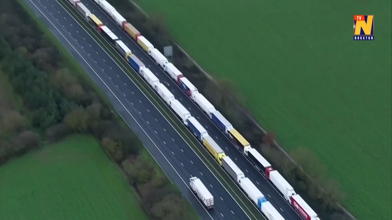 Aerials show long truck queues as the UK strives to lift France's freight ban