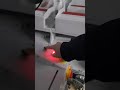 Double sided tape application machine for irregular cardboard