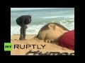 Индийский художник создал песчаную скульптуру в память о погибшем сирийском мальчике