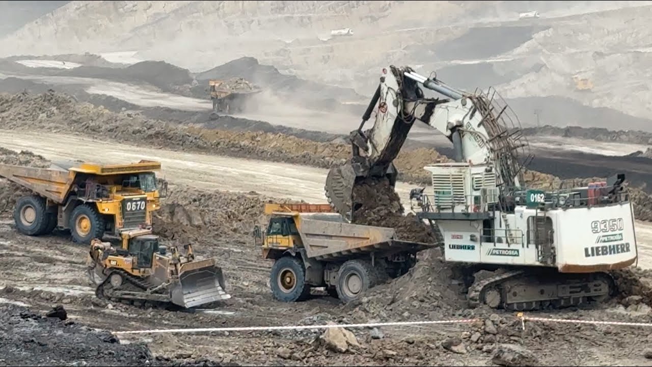 Big dump truck komatsu Hd 785-7 loading on Liebherr 9350 Excavator