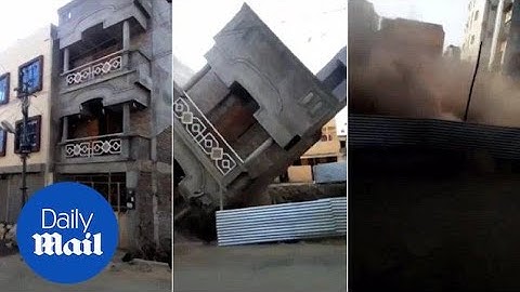 Sudden collapse of three-storey building caught on camera - Daily Mail