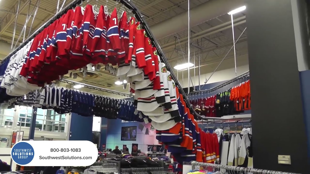 Hangers With Clothes On Garment Conveyor At Dry-cleaner's Stock Photo,  Picture and Royalty Free Image. Image 198000170.