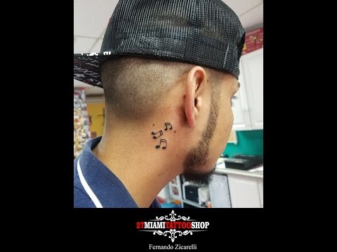 Music notes tattoo