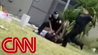 Cop kicks handcuffed suspect in the head