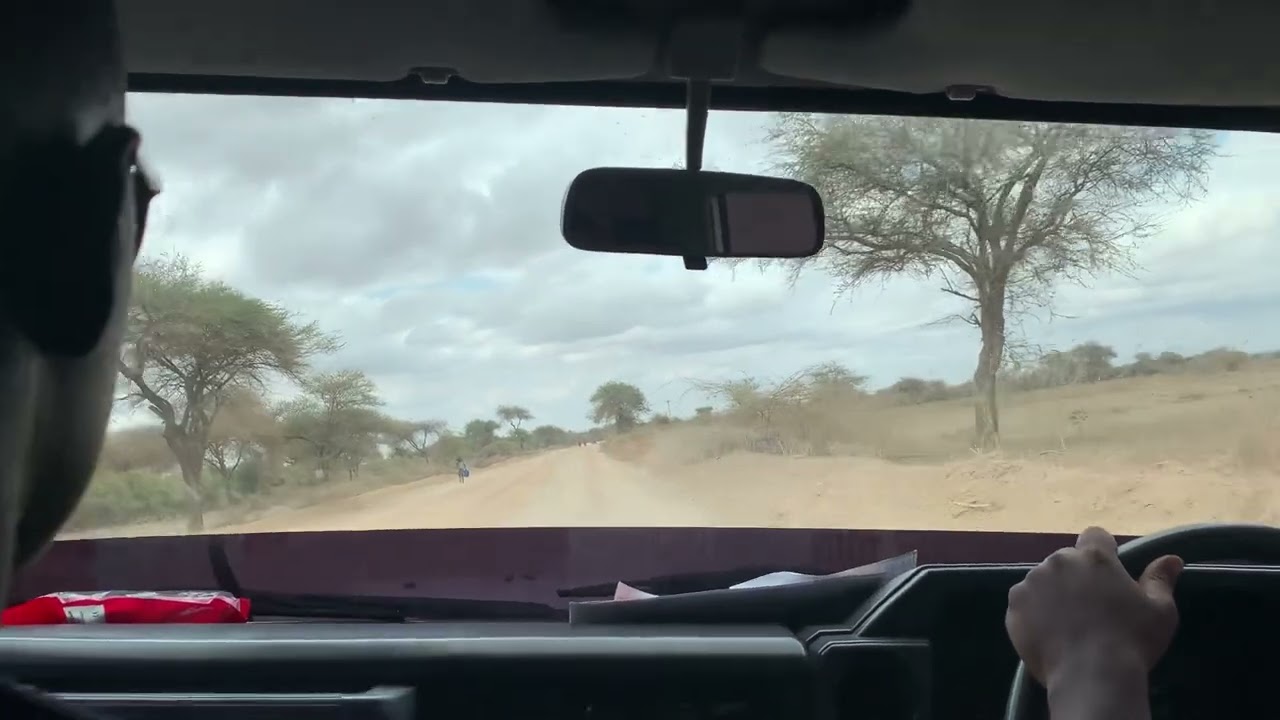 Driving on a Wide Dirt Road in Northern Tanzania – Passing Lorries POV 