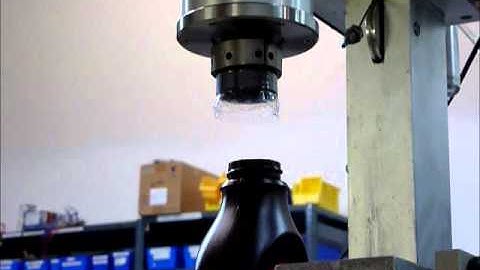 SureTorque torque tester/uncapper removing a sealed cap