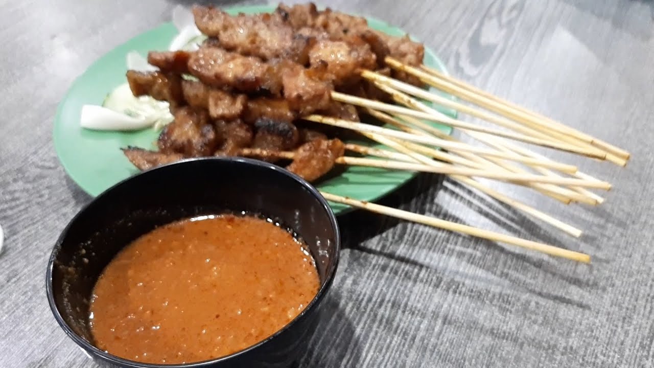 Berseh Food Centre : Chargrilled. Pork Satay. Cooked over Charcoal. Tender meat with a Peanut Sauce