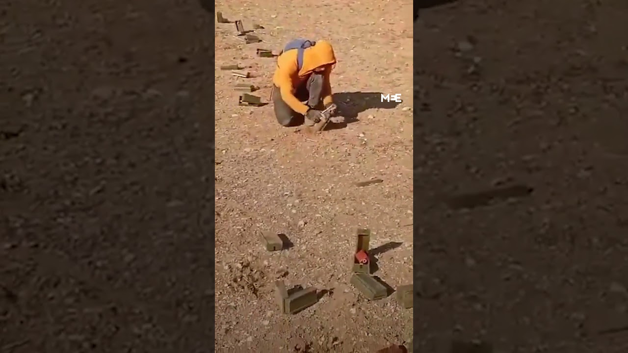 Young Syrian removes mines on the outskirts of the city of al-Bab.