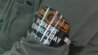 Community members honor those killed at work