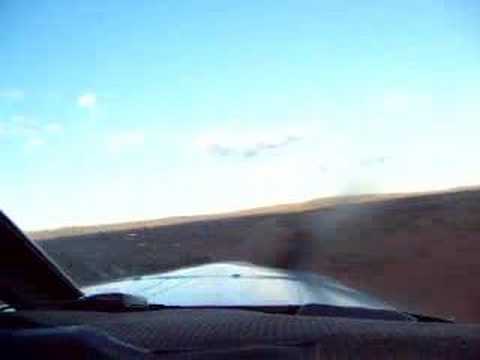 Landing on the airstrip for a remote Outback station, to deliver the mail and uplift anything waiting to go back to the city. We're in a small mail plane doing the weekly mail run for far western New South Wales.