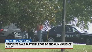 Students take part in pledge to end gun violence.