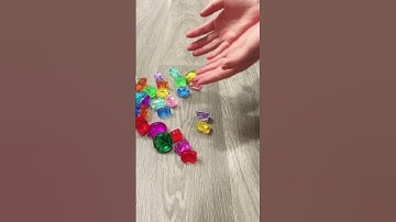 Satisfying colorful gems falling down reverse video ASMR!