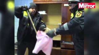 Cleaners get a nasty surprise when they find angry snake while loading laundry into washing machine