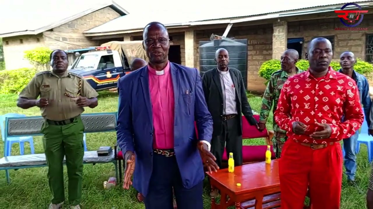 RESIDENTS OF GWITEMBE AND ANGA'TA HOLD PRAYERS AT ANG'ATA POLICE STATION.