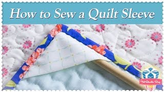 We are back in the studio with Sherri McConnell today and she is going to show you how she puts sleeves on her mini quilts. 