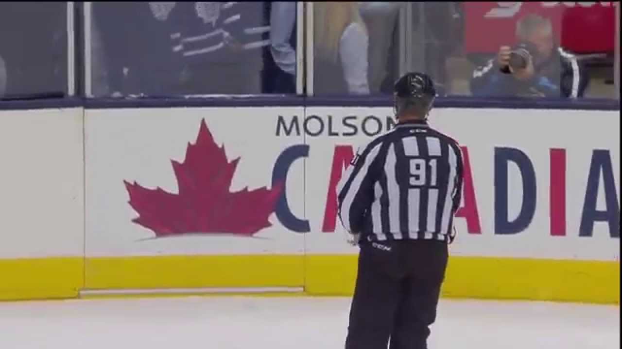 oilers fan throws jersey on ice