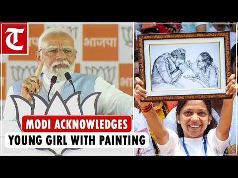 Young girl displays painting of PM Modi with his mother during Karnataka rally