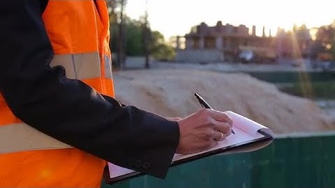 Engineer Writes On Log Stock Video