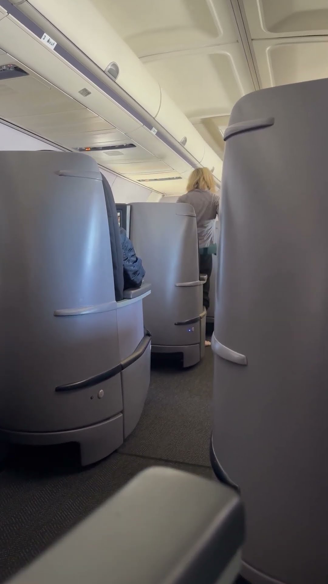 Airplane Passenger Exercises in Her Seat || ViralHog
