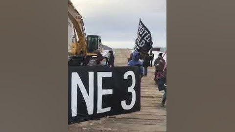 Protesters block Line 3 construction by locking themselves to an excavator