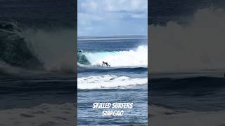 Skilled local surfers in Siargao