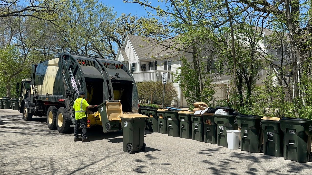 Groot Split McNeilus Rear Loader Garbage Truck Packing Trash & Recycle on the Never Ending Cart Line