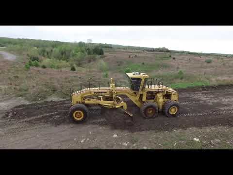 Champion 100T road grader in action.