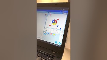 Corwin demonstrating the Catch the Dots game he made at camp!