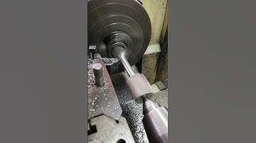USING KNIFE TOOL ON THE UNIVERSAL LATH TO MACHINE ROUND TENSILE SAMPLE BEFORE TENSION TEST
