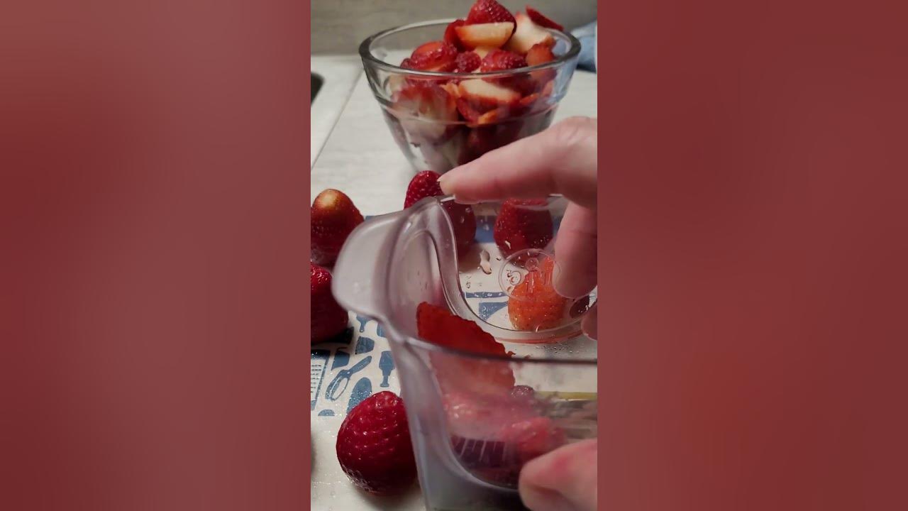 The Pampered Chef Cup Slicer cutting fresh strawberries 