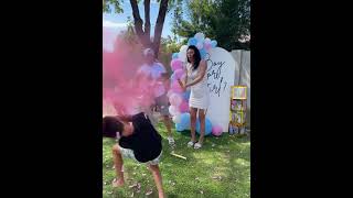 Woman twists party popper that explodes pink dust on boys face (Gender reveal fail)