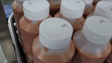 Printing down onto plastic sauce bottle lids with a Sojet thermal inkjet printer