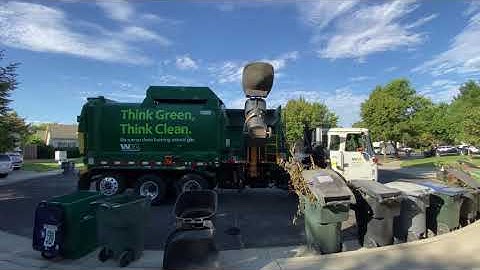 Autocar Labrie Automizer on a Big Line of Green Waste Carts