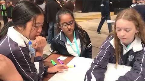 Secondary Students explaining their projects at a HackAThon II