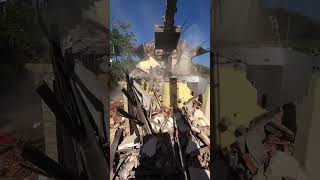 House Demolition With an Excavator
