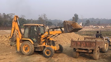 New Backhoe Loader Loading Soil In Tractor Dump