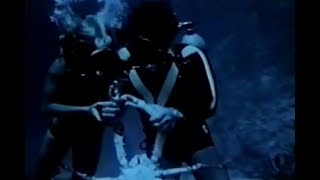Scuba couple underwater 1970s