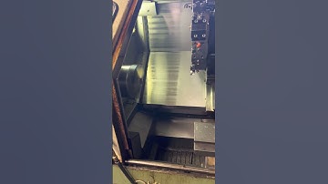 Okuma LB15 CNC Turning Center w/ Okuma Model OSP-5020L CNC controller, Enomoto EC27 Chip Conveyor