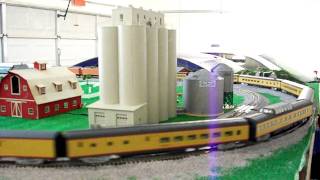 Super long Union Pacific 844 and passenger cars rolling through my layout