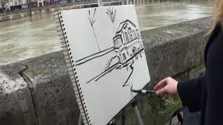 Zoia charcoal sketching the flooded seine in Paris.