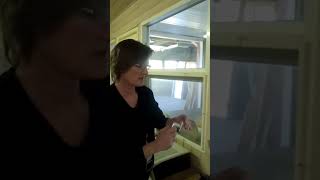 A Woman Shows How To Replace A Handle On A Window