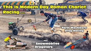 This is 21st Century Roman Chariot Racing: Farm Machinery & Snowmobile Drag in 34 degrees!