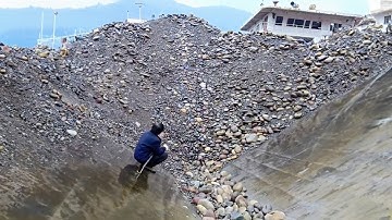 First view of self-unloading ship unloading 3500 tons of cobblestones original sound stress relief!