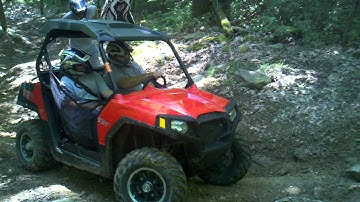 Polaris rzr 570 climbing rocky hill