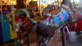 addi and daddy ride the carousel